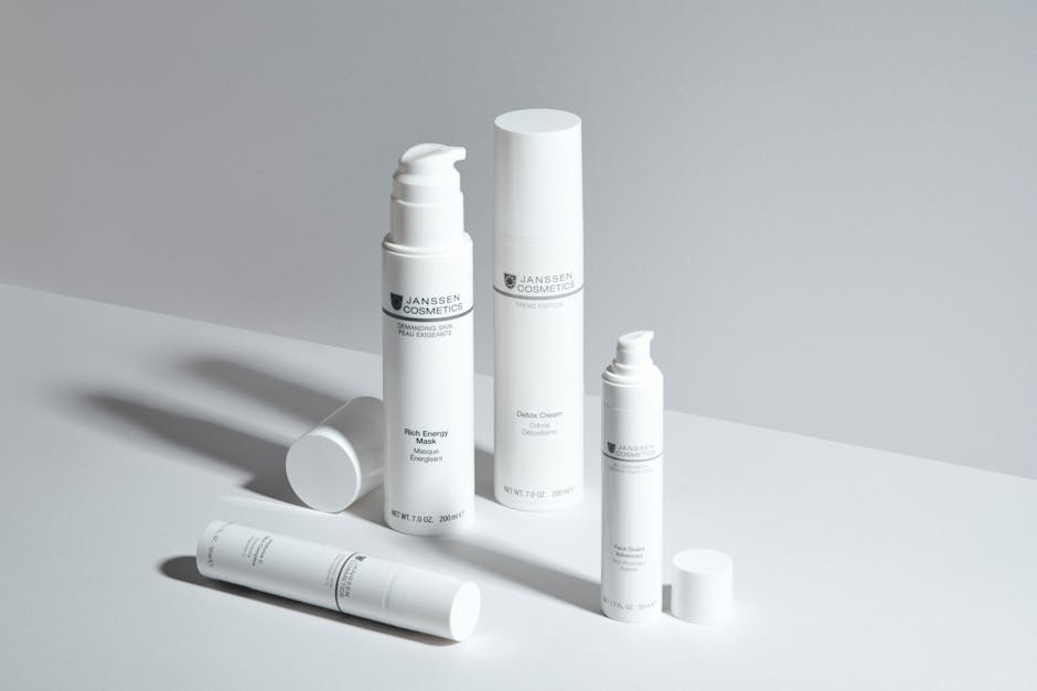 A minimalistic display of skincare bottles showcasing Janssen Cosmetics with a clean white backdrop.